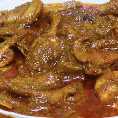 Bengali duck curry with potatoes and warm spices in a rich gravy