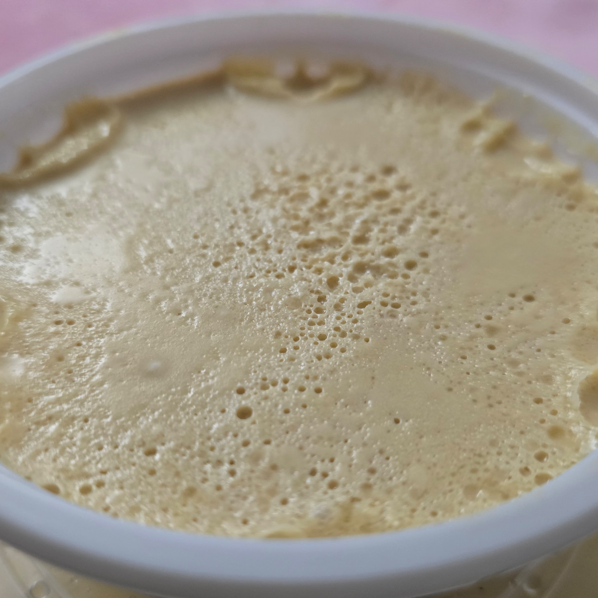 Bengali misti doi in a clay pot with glasses of falooda and borhani